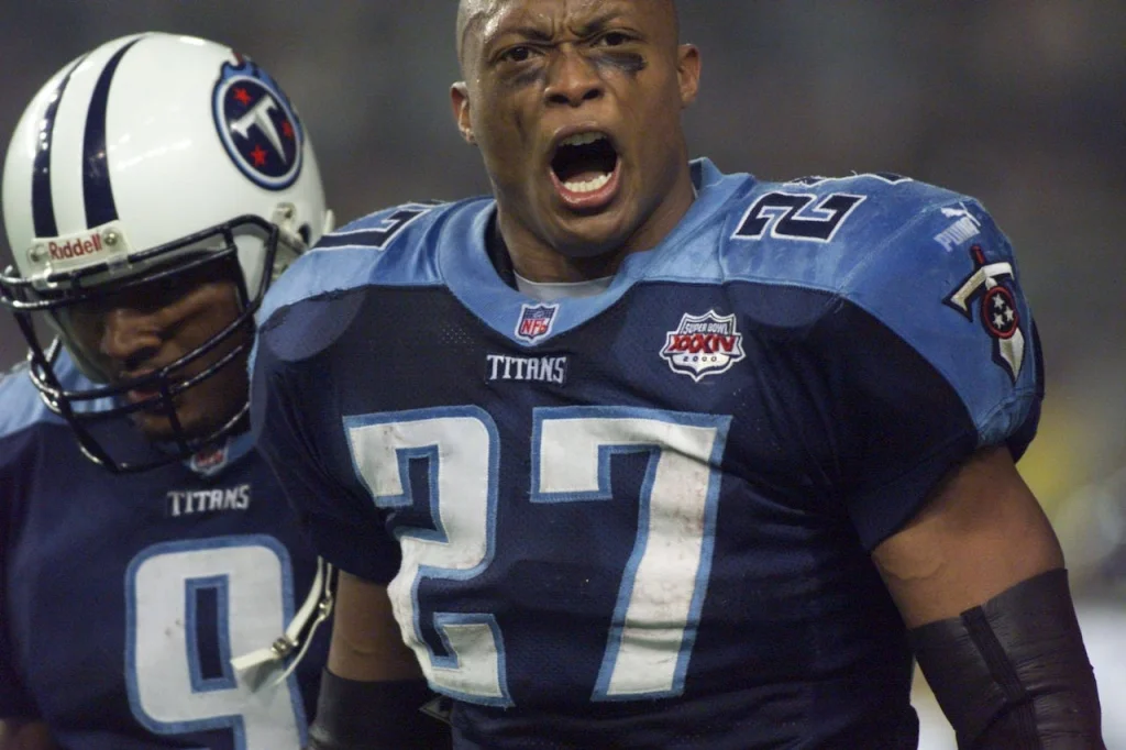 Eddie George celebrates his fourth quarter touchdown in Super Bowl XXXIV. Behind is quarterback Steve McNair/- - photo by Eric Parsons Eddie George
