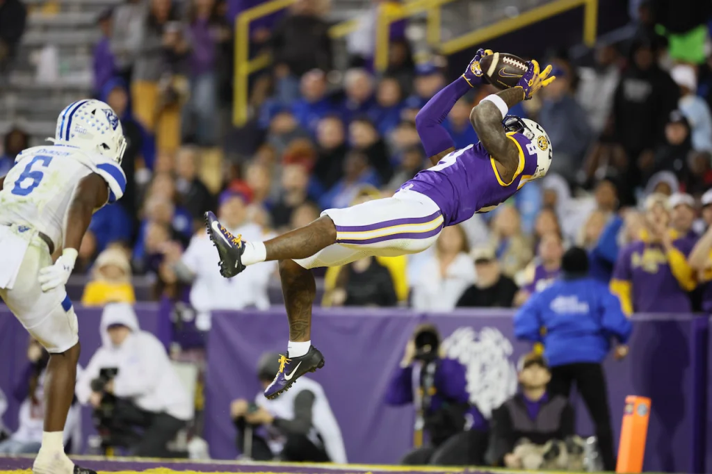 Nov 18, 2023; Baton Rouge, Louisiana, USA; LSU Tigers wide receiver Malik Nabers (8) hauls in a 40-yard touchdown pass against the Georgia State Panthers in the fourth quarter at Tiger Stadium. Mandatory Credit: Matthew Dobbins-USA TODAY Sports
