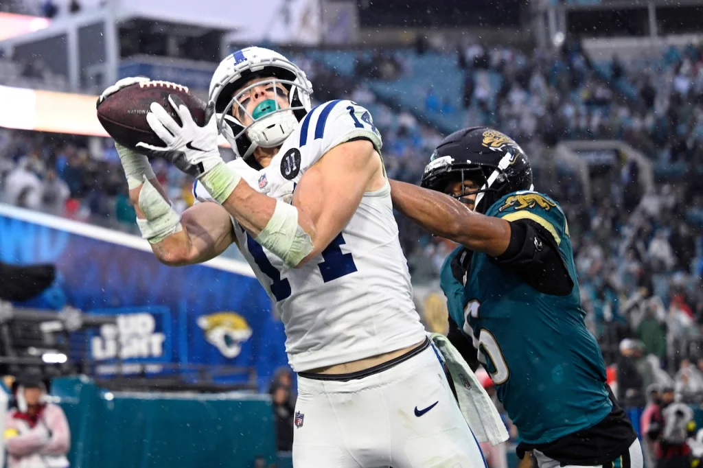 Indianapolis Colts wide receiver Alec Pierce (14) grabs a pass in the end zone in front of Jacksonville Jaguars cornerback Greg Newsome II (6) but can't compete the catch during the second half of an NFL football game, Sunday, Dec. 7, 2025, in Jacksonville, Fla. (AP Photo/Phelan M. Ebenhack)