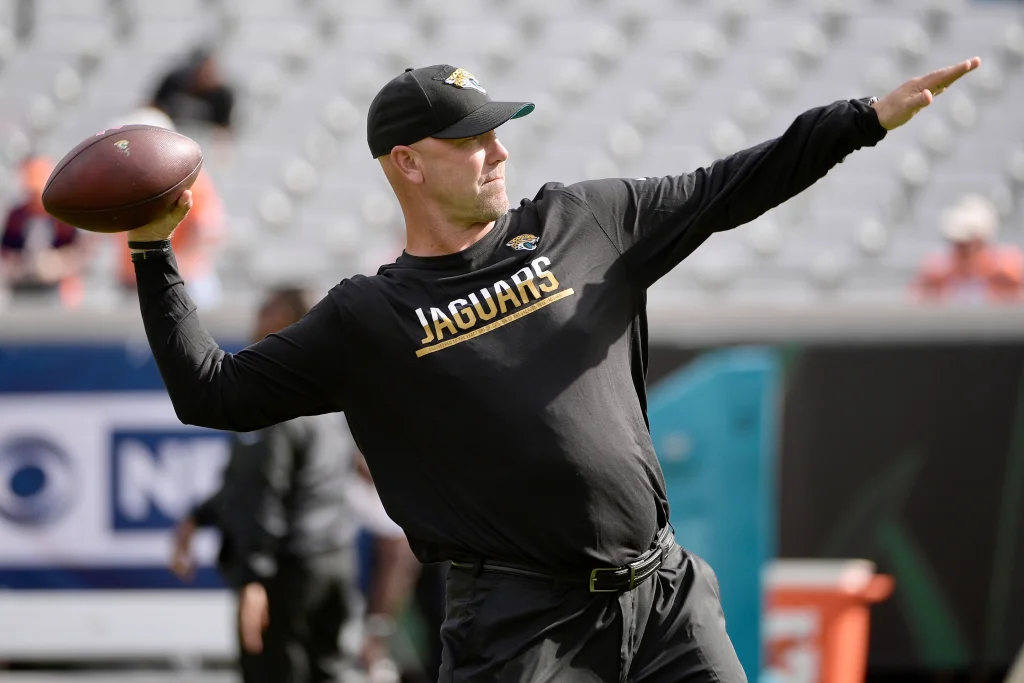 Jacksonville Jaguars head coach Gus Bradley throws a ball during warmups before an NFL football game against the Denver Broncos in Jacksonville, Fla., Sunday, Dec. 4, 2016. (AP Photo/Phelan M. Ebenhack)