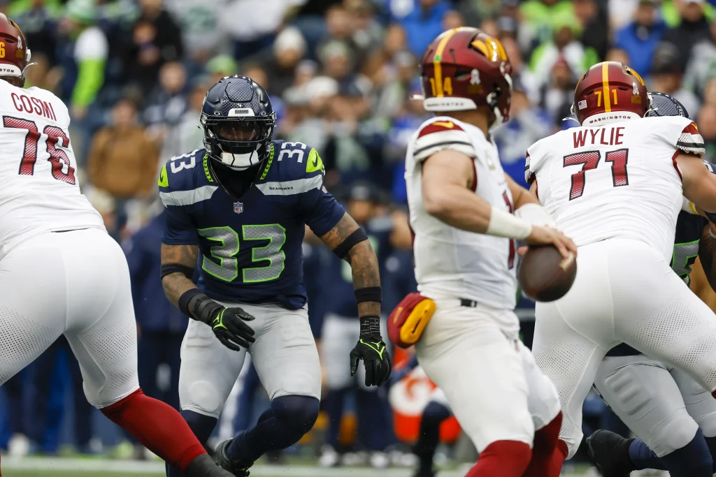 Nov 12, 2023; Seattle, Washington, USA; Seattle Seahawks safety Jamal Adams (33) blitzes against the Washington Commanders during the first quarter at Lumen Field. Mandatory Credit: Joe Nicholson-USA TODAY Sports