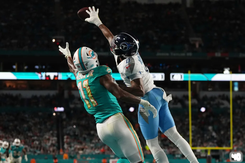 Dec 11, 2023; Miami Gardens, Florida, USA; Tennessee Titans cornerback Sean Murphy-Bunting (0) breaks up a pass to Miami Dolphins wide receiver Cedrick Wilson Jr. (11) during the second half at Hard Rock Stadium. Mandatory Credit: Jasen Vinlove-USA TODAY Sports