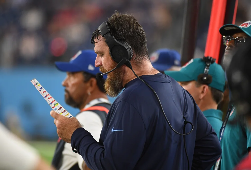 Aug 25, 2023; Nashville, Tennessee, USA; Tennessee Titans offensive coordinator Tim Kelly calls in plays during the second half against the New England Patriots at Nissan Stadium. Mandatory Credit: Christopher Hanewinckel-USA TODAY Sports