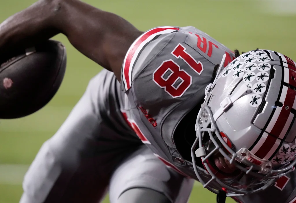 Nov. 11, 2023; Columbus, Oh., USA; Ohio State Buckeyes wide receiver Marvin Harrison Jr. (18) scores the first touchdown of the game during the first half of Saturday's NCAA Division I football game against the Michigan State Spartans.
