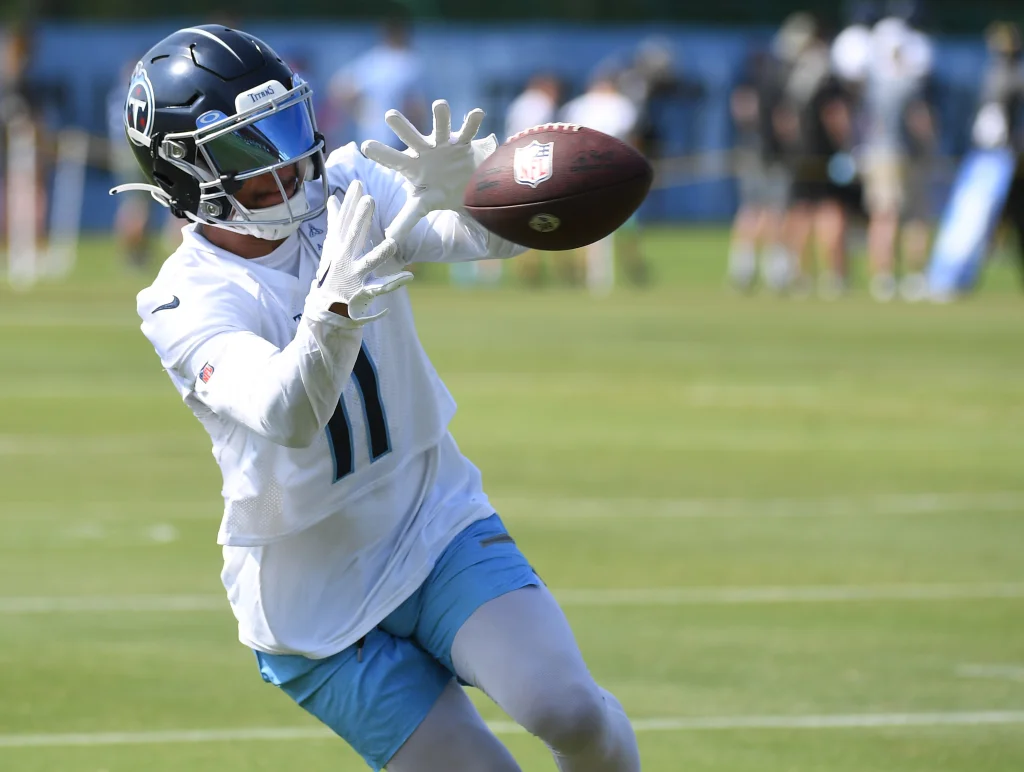 Jul 29, 2023; Nashville, TN, USA; Tennessee Titans wide receiver Chris Moore (11) catches a pass during drills at training camp. Mandatory Credit: Christopher Hanewinckel-USA TODAY Sports