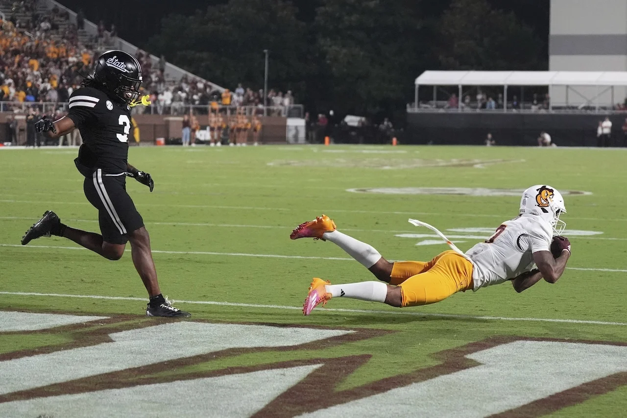 Arizona State wide receiver Jordyn Tyson (0) dives for a two-yard touchdown reception while being covered by Mississippi State safety Brylan Lanier (3) during the second half of an NCAA college football game in Starkville, Miss., Saturday, Sept. 6, 2025. Mississippi State won 24-20. (AP Photo/Rogelio V. Solis)