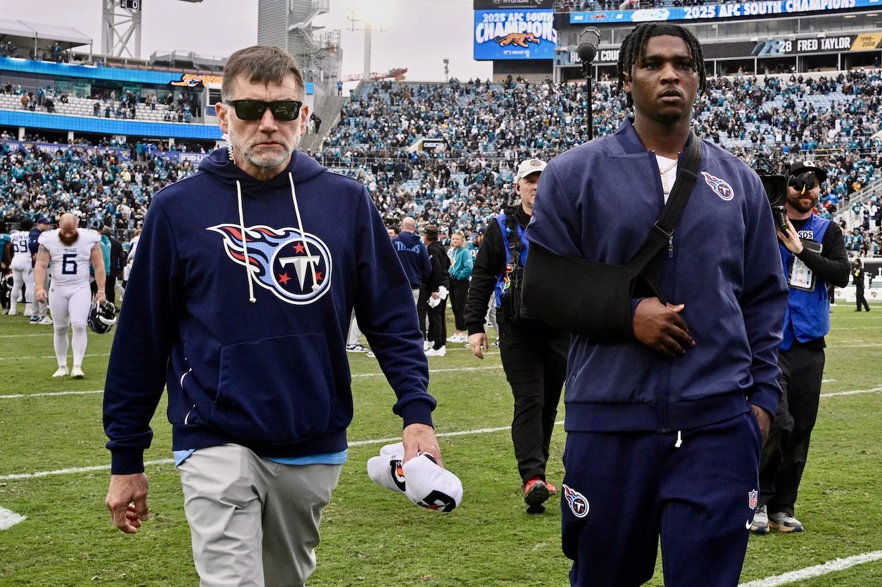 Tennessee Titans quarterback Cam Ward, right, leaves the field after the team's loss in an NFL football game against the Jacksonville Jaguars, Sunday, Jan. 4, 2026, in Jacksonville, Fla. (AP Photo/Phelan M. Ebenhack)