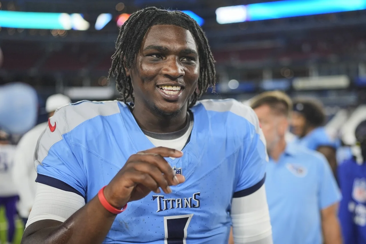 Tennessee Titans quarterback Cam Ward celebrates the team's win after a preseason NFL football game against the Minnesota Vikings, Friday, Aug. 22, 2025, in Nashville, Tenn. (AP Photo/George Walker IV)