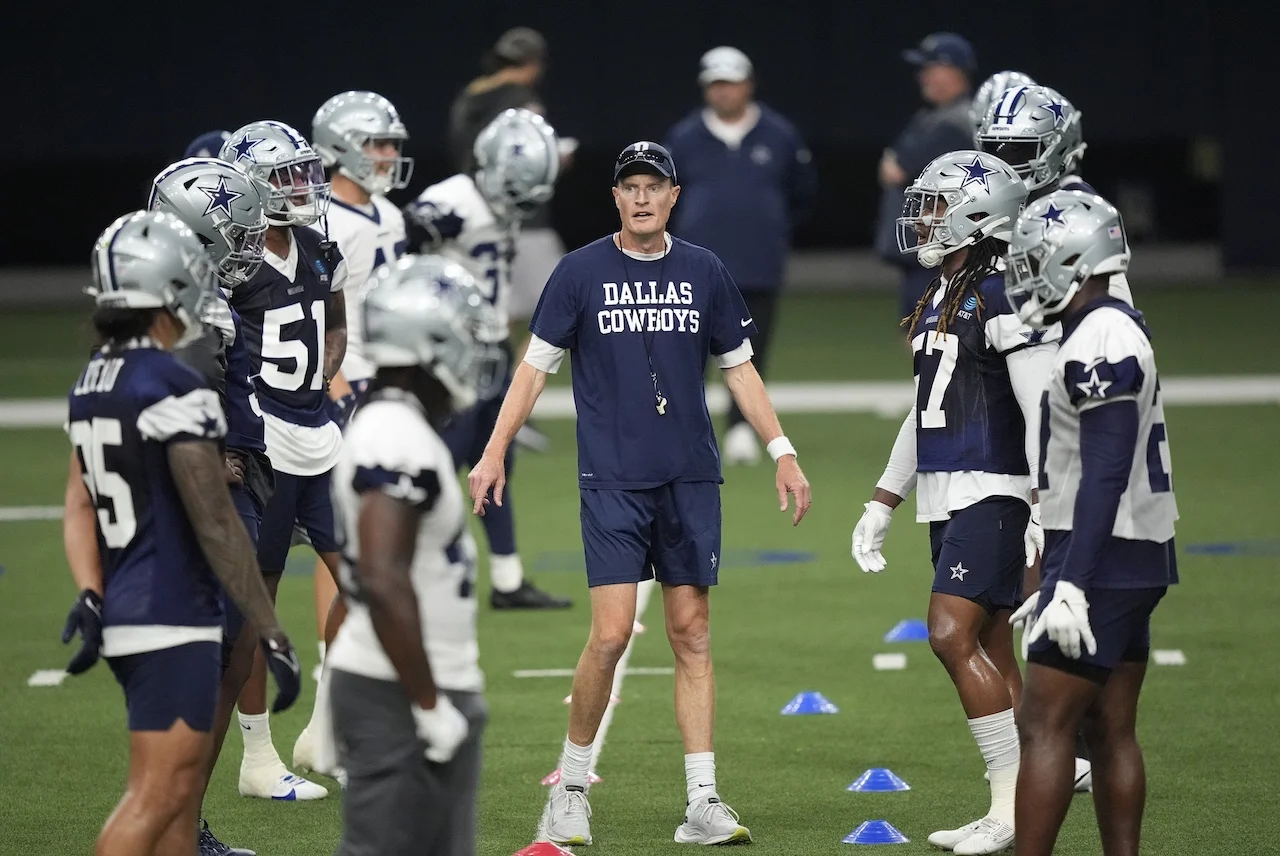 Dallas Cowboys special teams coordinator John Fassel, center, works with players during an NFL football team practice in Frisco, Texas, Wednesday, May 22, 2024. (AP Photo/LM Otero)