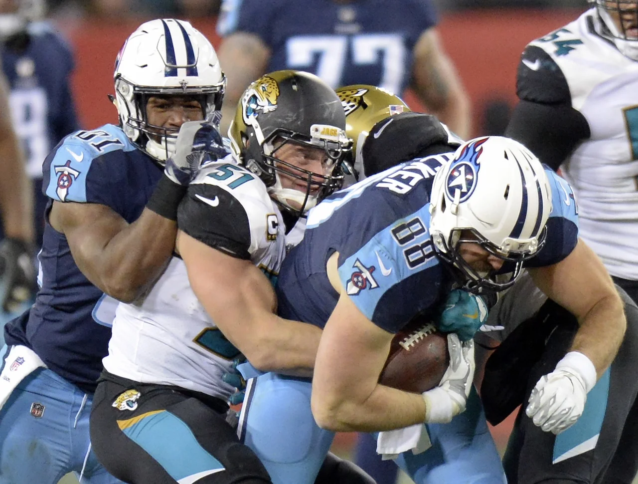Tennessee Titans tight end Jace Amaro (88) tries to break free from Jacksonville Jaguars middle linebacker Paul Posluszny (51) in the second half of an NFL football game Sunday, Dec. 31, 2017, in Nashville, Tenn. (AP Photo/Mark Zaleski)