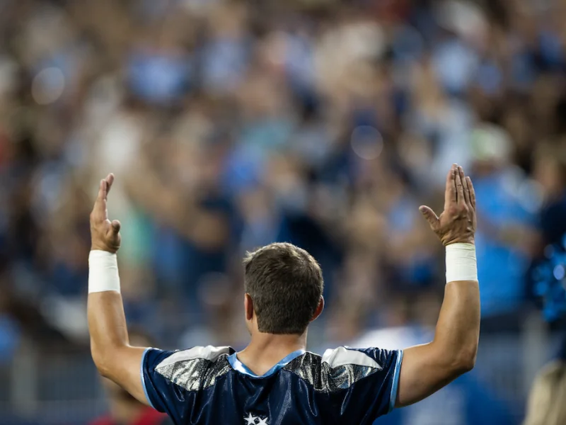 A fan celebrates a touchdown at a Tennessee Titans game.