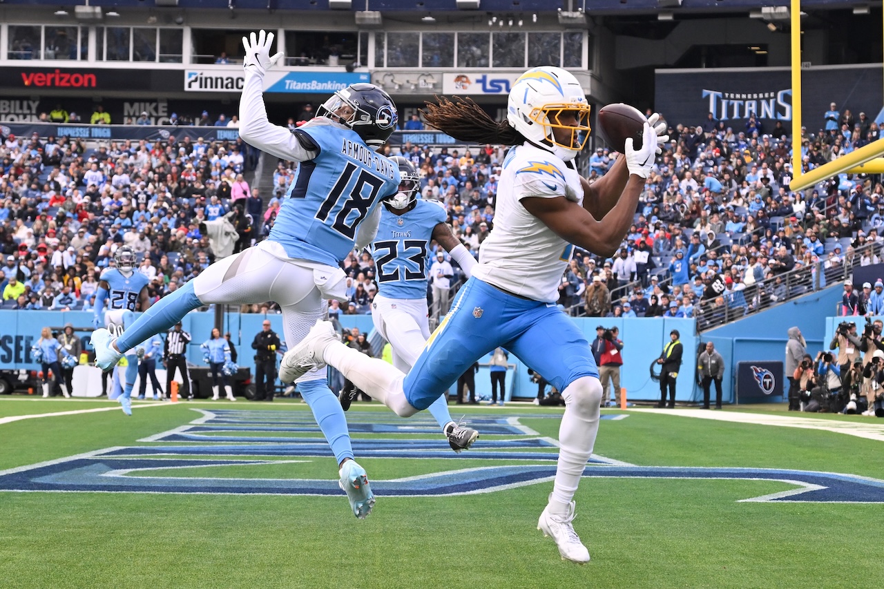 Los Angeles Chargers wide receiver Quentin Johnston (1) makes a touchdown catch past Tennessee Titans cornerback Jalyn Armour-Davis (18) during the first half of an NFL football game Sunday, Nov. 2, 2025, in Nashville, Tenn. (AP Photo/John Amis)