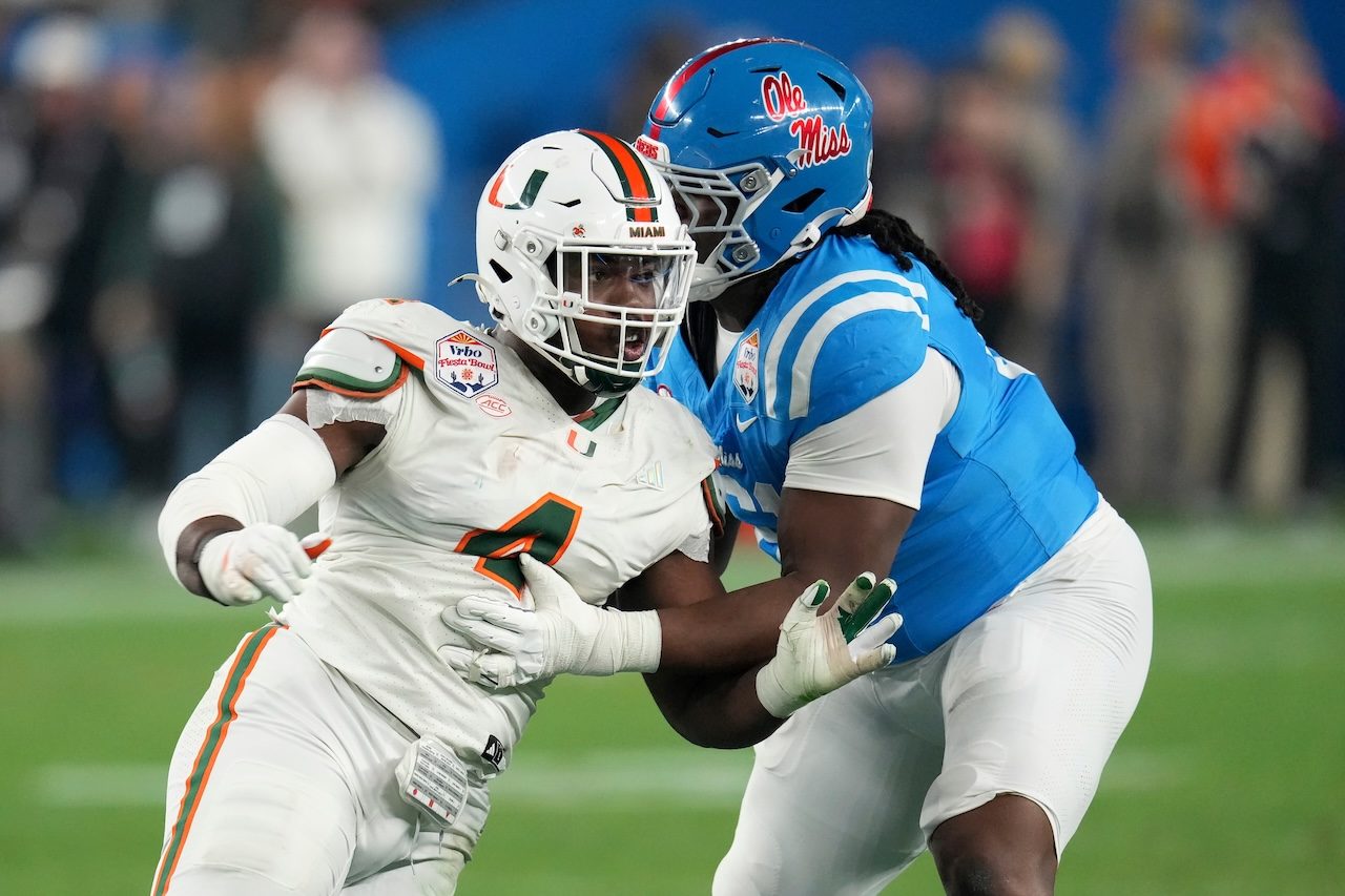Miami defensive lineman Rueben Bain Jr., left, tries to get past Mississippi offensive lineman Diego Pounds, right, during the second half of the Fiesta Bowl NCAA college football playoff semifinal game, Thursday, Jan. 8, 2026, in Glendale, Ariz. (AP Photo/Ross D. Franklin)