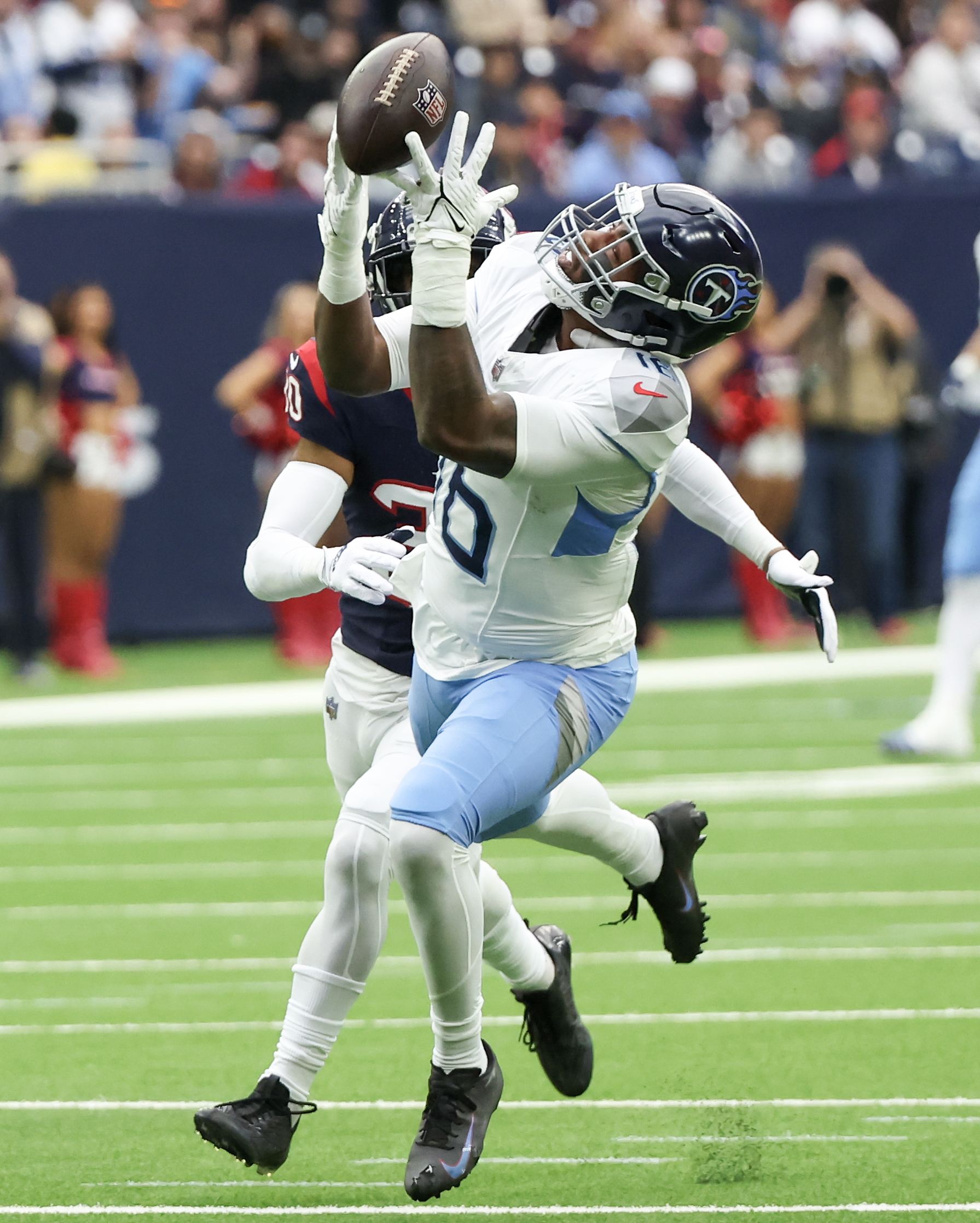 Dec 31, 2023; Houston, Texas, USA; Tennessee Titans wide receiver Treylon Burks (16) drops a pass while being covered by Tennessee Titans cornerback Tay Gowan (30) in the first quarter at NRG Stadium. Mandatory Credit: Thomas Shea-USA TODAY Sports