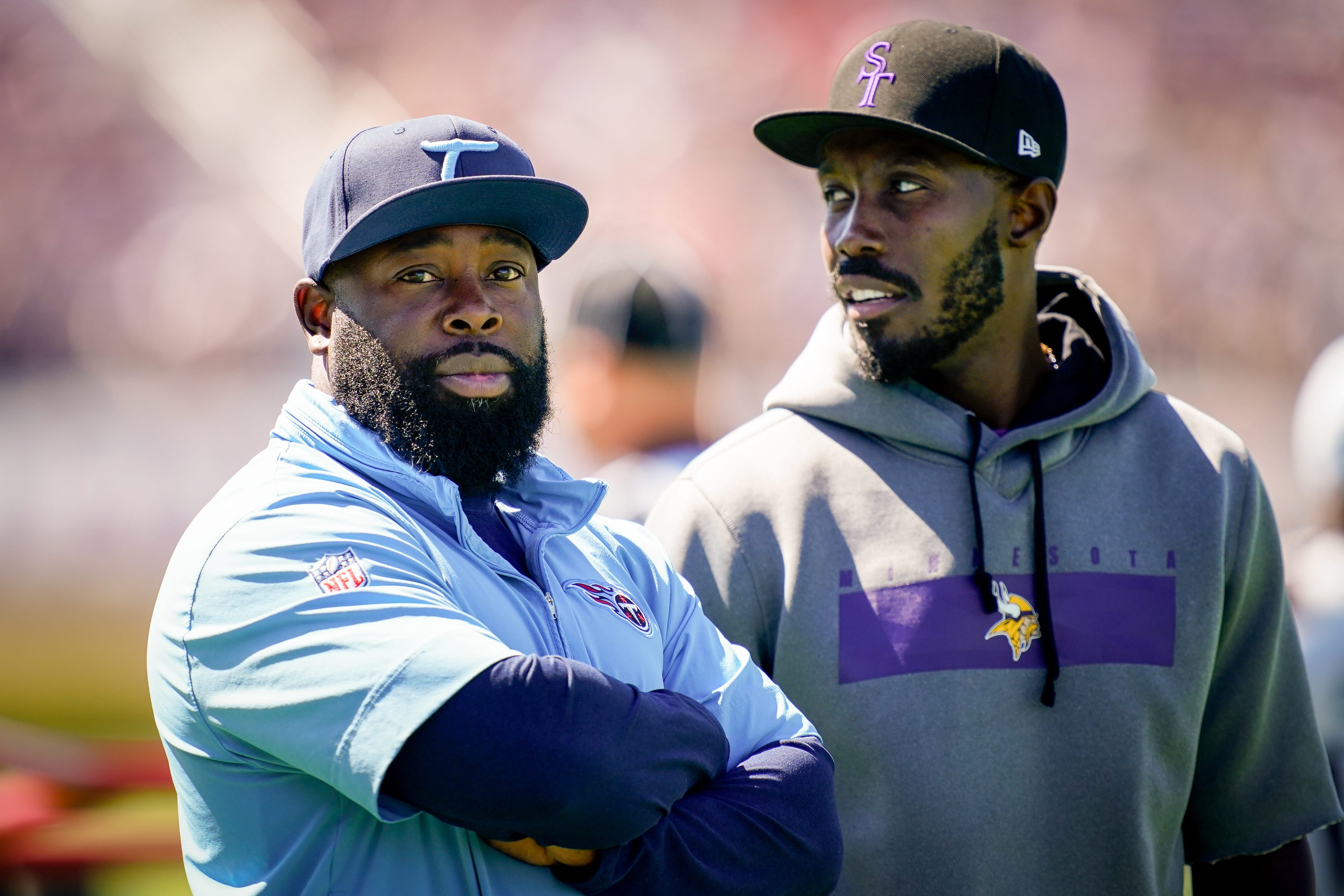 Tennessee Titans general manager Ran Carthon, left, chats with Minnesota Vikings general manager Kwesi Adofo-Mensah during practice in Eagan, Minn., on Aug. 16, 2023.
