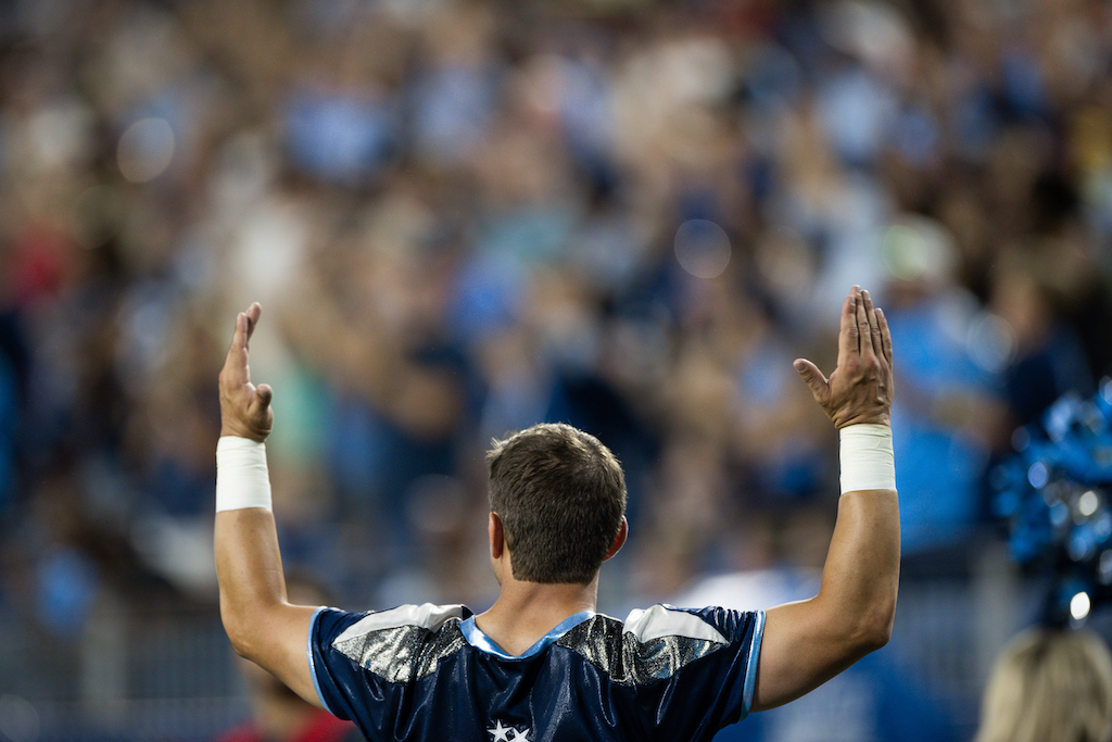 A fan celebrates a touchdown at a Tennessee Titans game.
