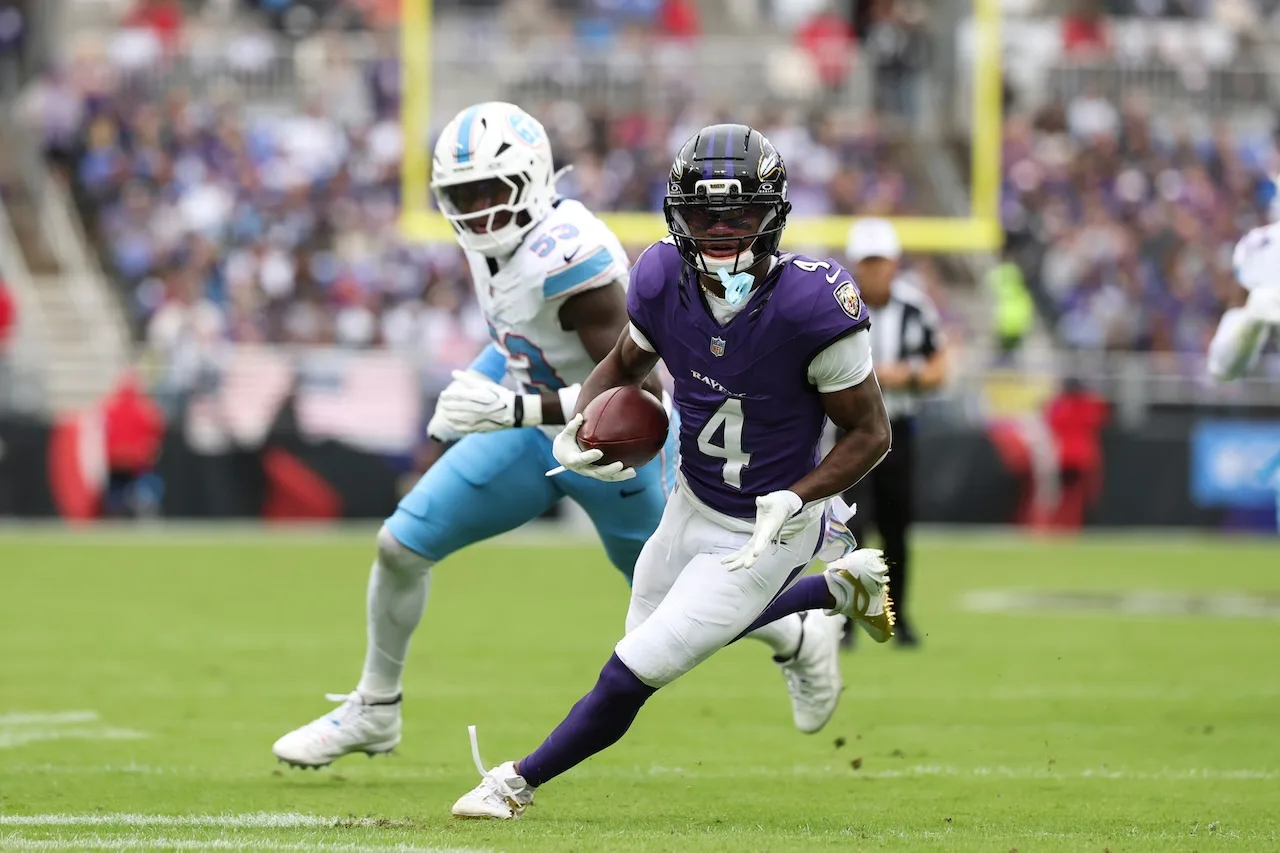 Baltimore Ravens wide receiver Zay Flowers (4) runs with the ball after catching a pass for a touchdown during the first half of an NFL football game against the Tennessee Titans in Baltimore, Sunday, Oct. 4, 2026. (AP Photo/Terrance Williams)