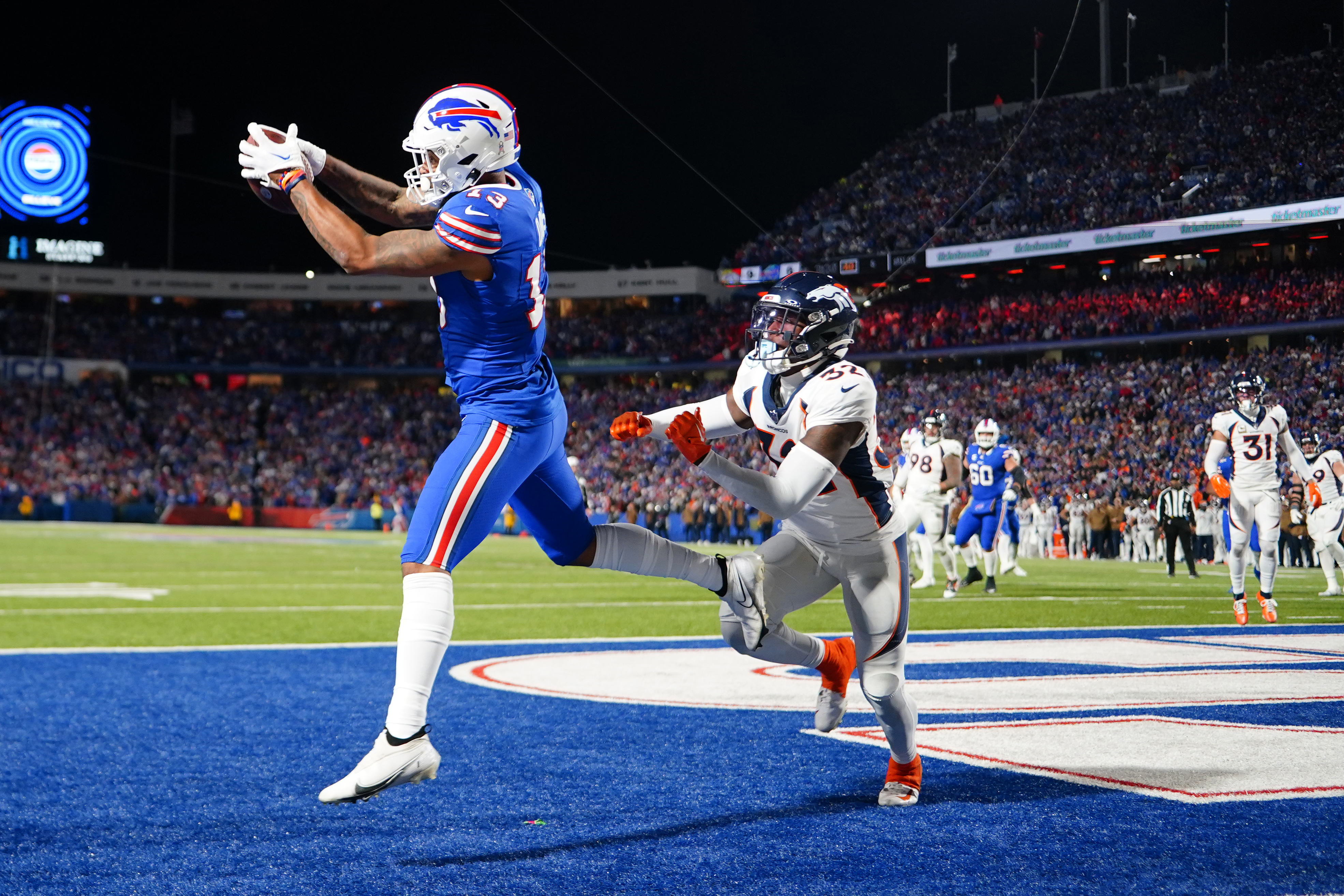 Nov 13, 2023; Orchard Park, New York, USA; Buffalo Bills wide receiver Gabe Davis (13) catches a pass for a two-point conversion against Denver Broncos safety Delarrin Tuner-Yell (32) during the first half at Highmark Stadium. Mandatory Credit: Gregory Fisher-USA TODAY Sports