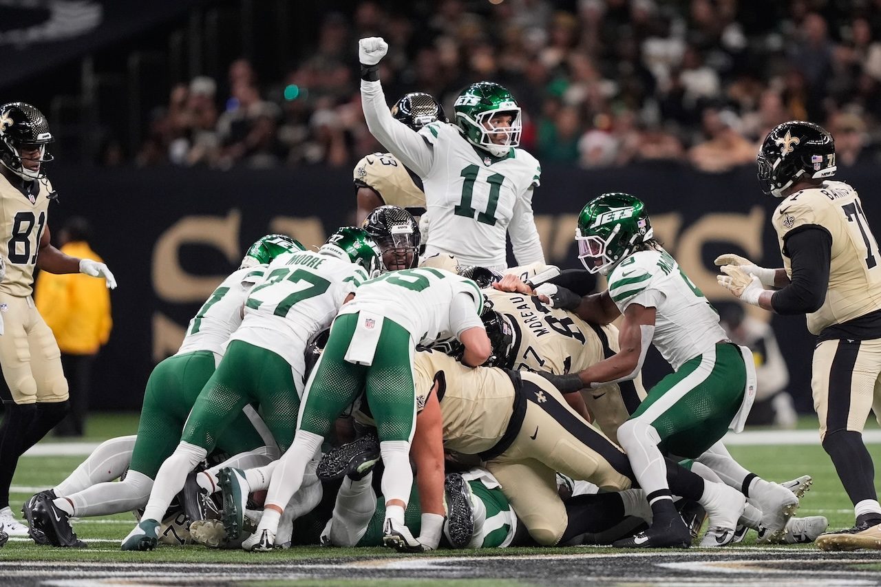 New York Jets linebacker Jermaine Johnson II (11) react after the Jets stopped the New Orleans Saints on fourth down during the first half of an NFL football game Sunday, Dec. 21, 2025, in New Orleans. (AP Photo/Gerald Herbert)