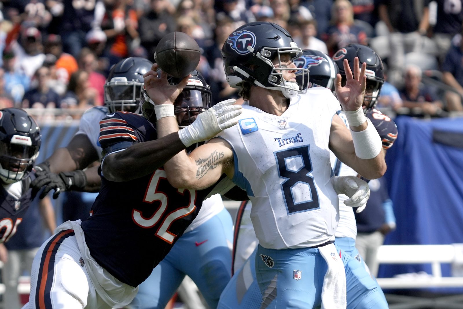 Chicago Bears defensive end Darrell Taylor (52) creates a fumble sack of Tennessee Titans quarterback Will Levis during the second half of an NFL football game Sunday, Sept. 8, 2024, in Chicago. (AP Photo/Nam Y. Huh)