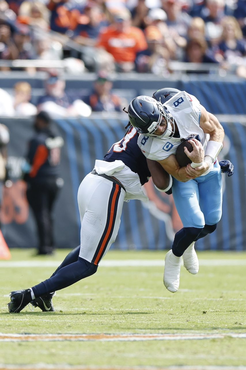 Chicago Bears linebacker Tremaine Edmunds (49) tackles Tennessee Titans quarterback Will Levis (8) during the second half of an NFL football game, Sunday, Sept. 8, 2024, in Chicago. The Bears defeated the Titans 24-17. (AP Photo/Kamil Krzaczynski)
