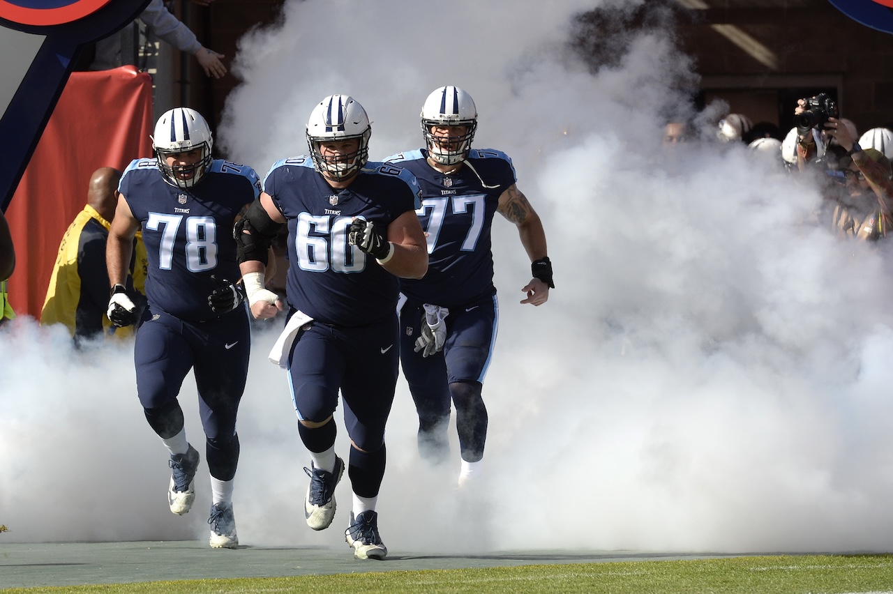 Tennessee Titans players Jack Conklin (78), Ben Jones (60) and Taylor Lewan (77) take the field for an NFL football game against the Houston Texans Sunday, Dec. 3, 2017, in Nashville, Tenn. (AP Photo/Mark Zaleski)