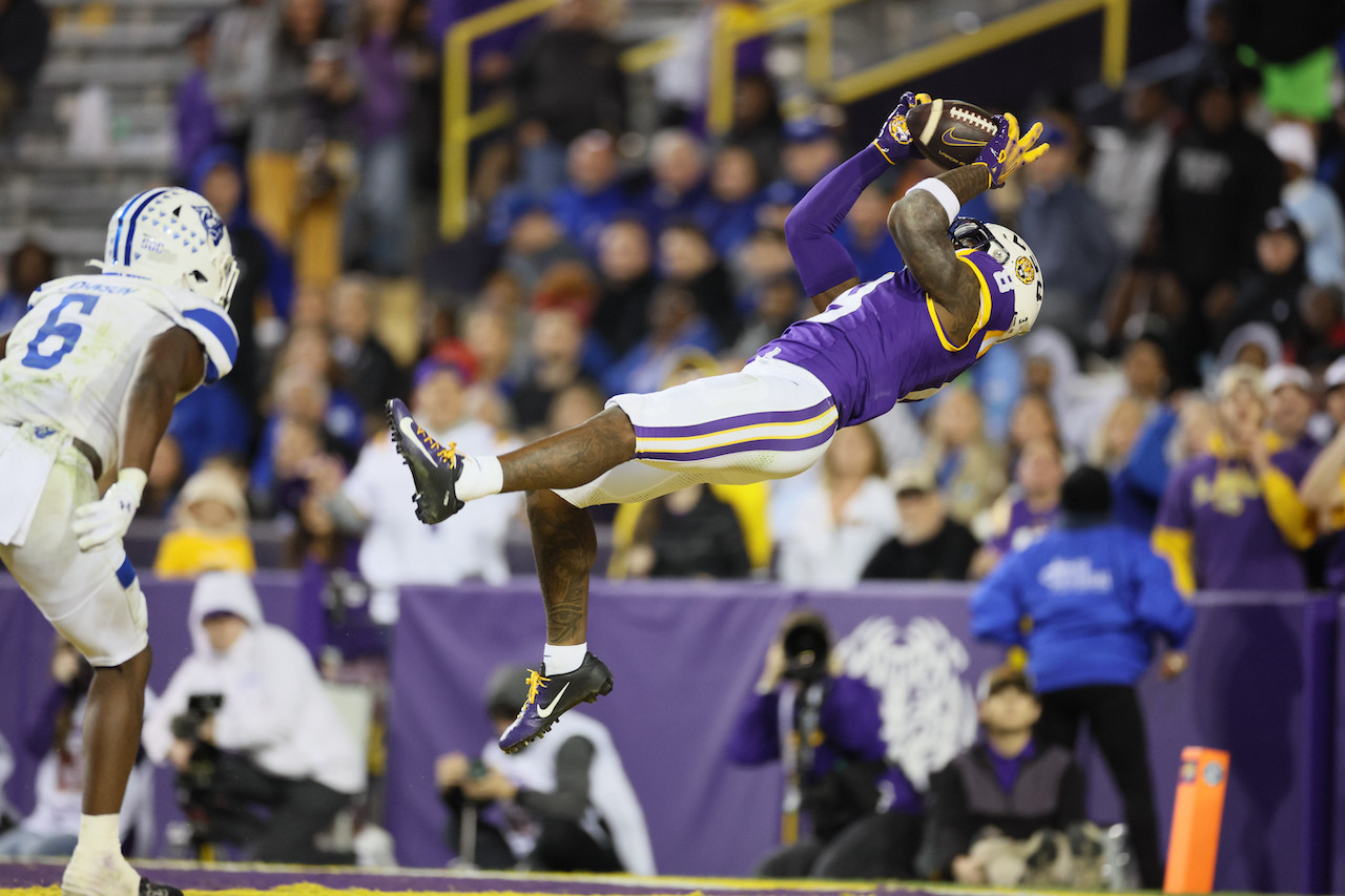 Nov 18, 2023; Baton Rouge, Louisiana, USA; LSU Tigers wide receiver Malik Nabers (8) hauls in a 40-yard touchdown pass against the Georgia State Panthers in the fourth quarter at Tiger Stadium. Mandatory Credit: Matthew Dobbins-USA TODAY Sports