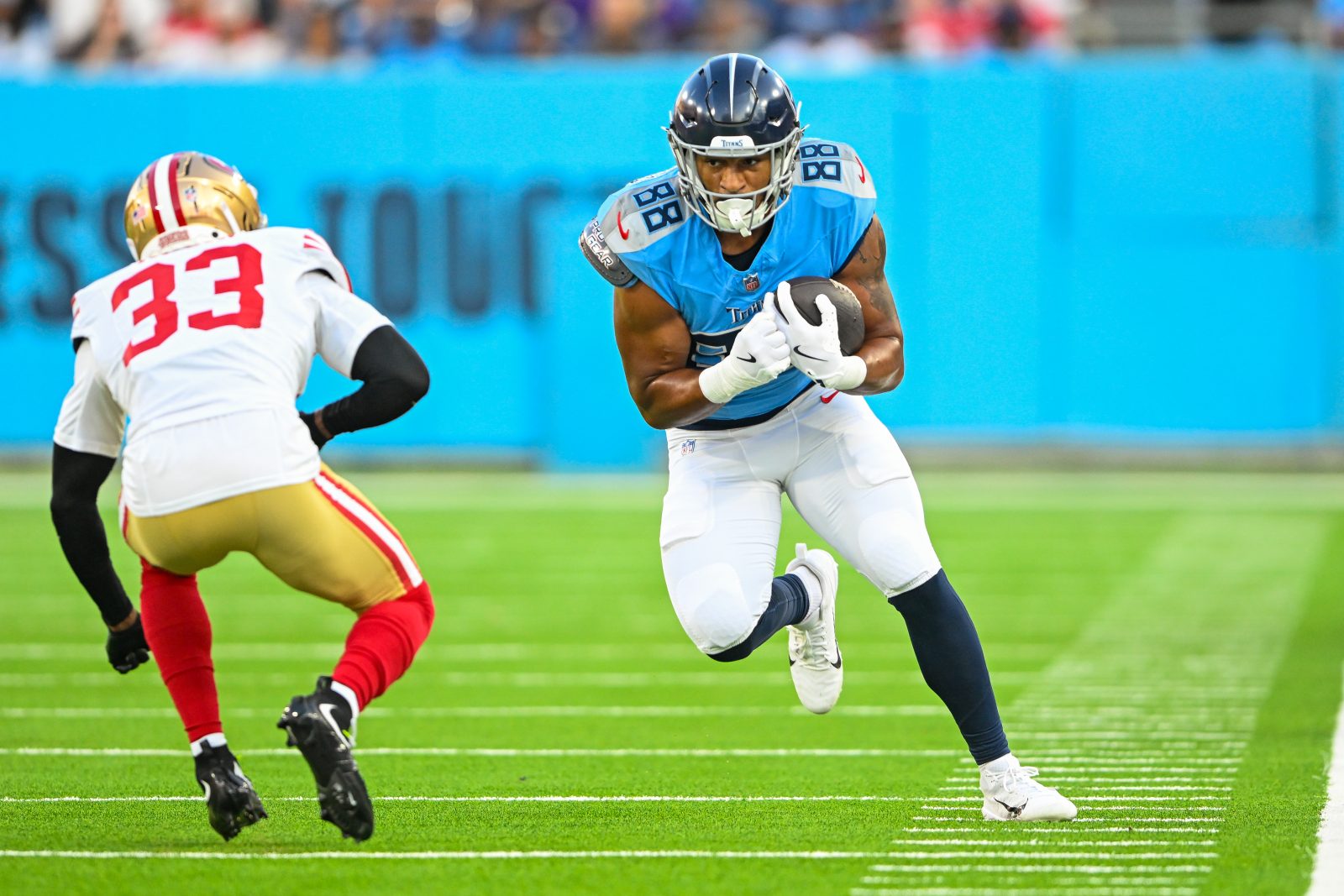 Aug 10, 2024; Nashville, Tennessee, USA; Tennessee Titans tight end David Martin-Robinson (88) runs through San Francisco 49ers cornerback Rock Ya-Sin (33) during the first half at Nissan Stadium. Mandatory Credit: Steve Roberts-USA TODAY Sports