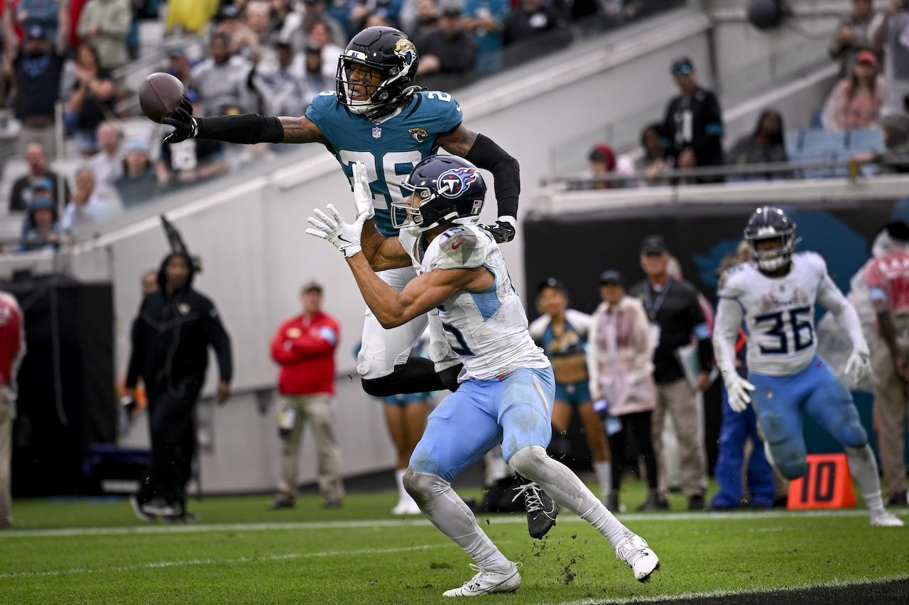 Jacksonville Jaguars safety Antonio Johnson (26) breaks up a pass intended fro Tennessee Titans wide receiver Nick Westbrook-Ikhine (15) during the second half of an NFL football game, Sunday, Dec. 29, 2024, in Jacksonville, Fla. (AP Photo/Phelan M. Ebenhack)