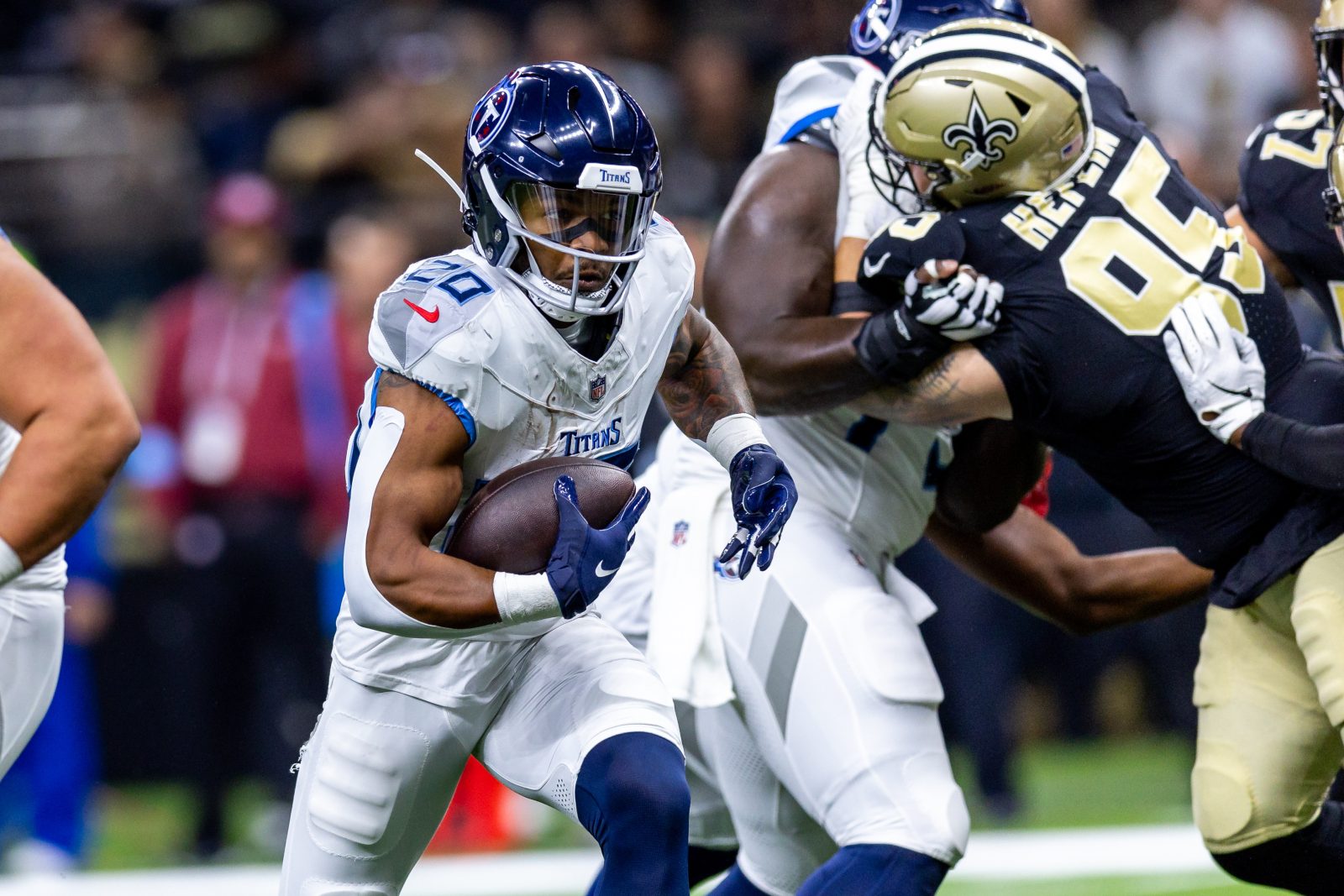 Aug 25, 2024; New Orleans, Louisiana, USA; New Orleans Saints defensive tackle Jack Heflin (95) attempts to shed his blocker to tackle Tennessee Titans running back Tony Pollard (20) during the first half at Caesars Superdome. Mandatory Credit: Stephen Lew-USA TODAY Sports