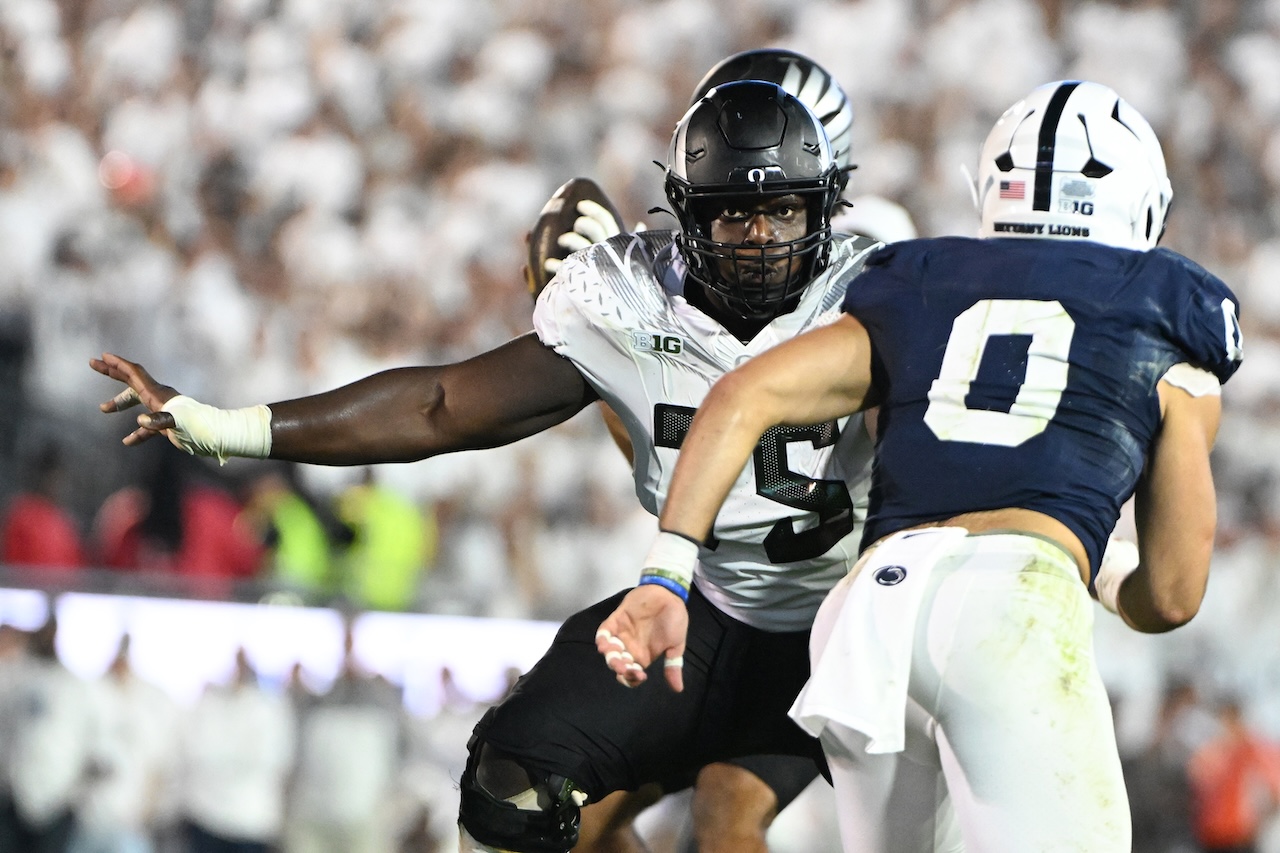 Oregon offensive lineman Emmanuel Pregnon (75) looks to block Penn State linebacker Dominic DeLuca (0) during the second half of an NCAA college football game, Saturday, Sept. 27, 2025, in State College, Pa. (AP Photo/Barry Reeger)