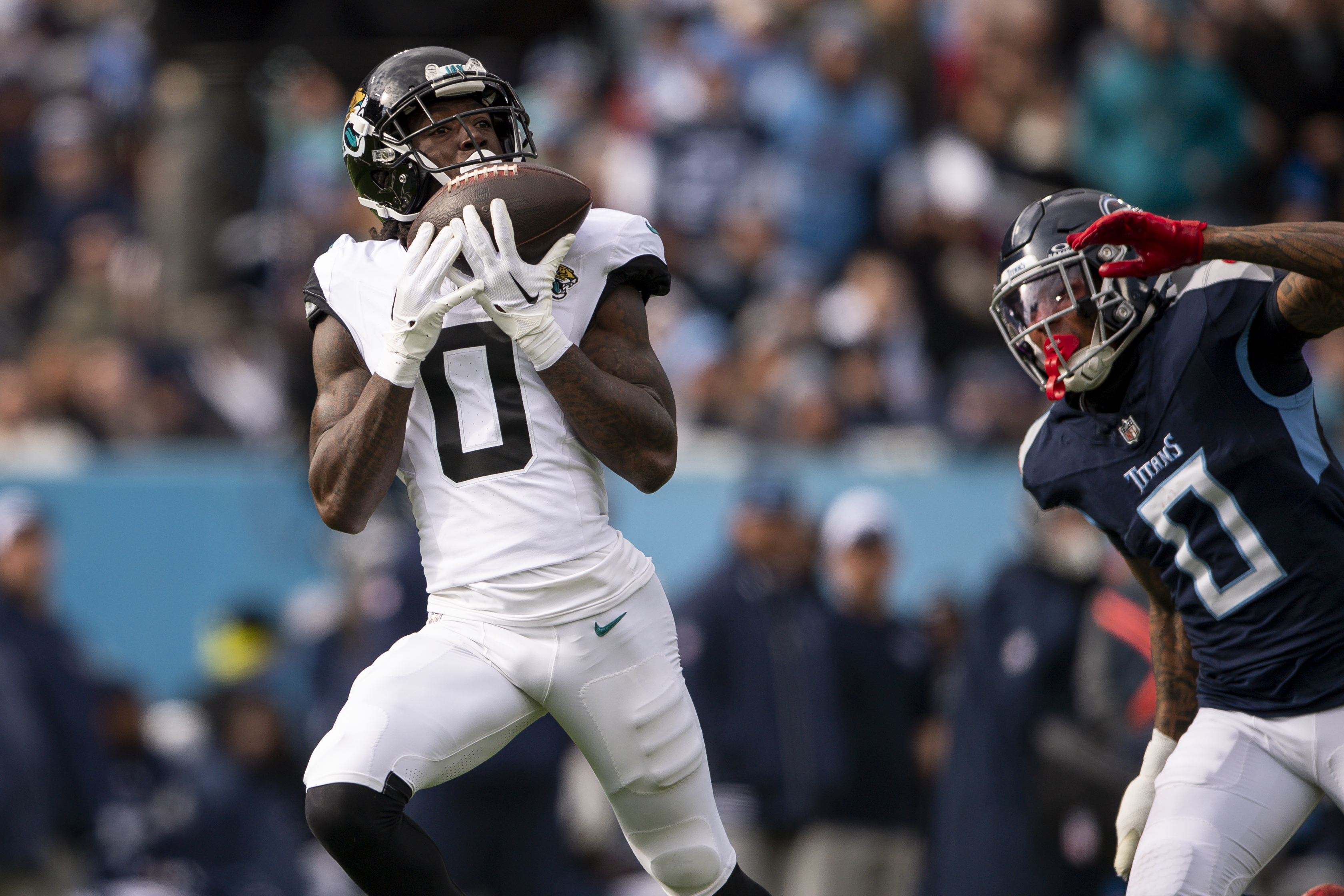 Jan 7, 2024; Nashville, Tennessee, USA; Jacksonville Jaguars wide receiver Calvin Ridley (0) scores a touchdown against the Tennessee Titans during the first half at Nissan Stadium. Mandatory Credit: Steve Roberts-USA TODAY Sports