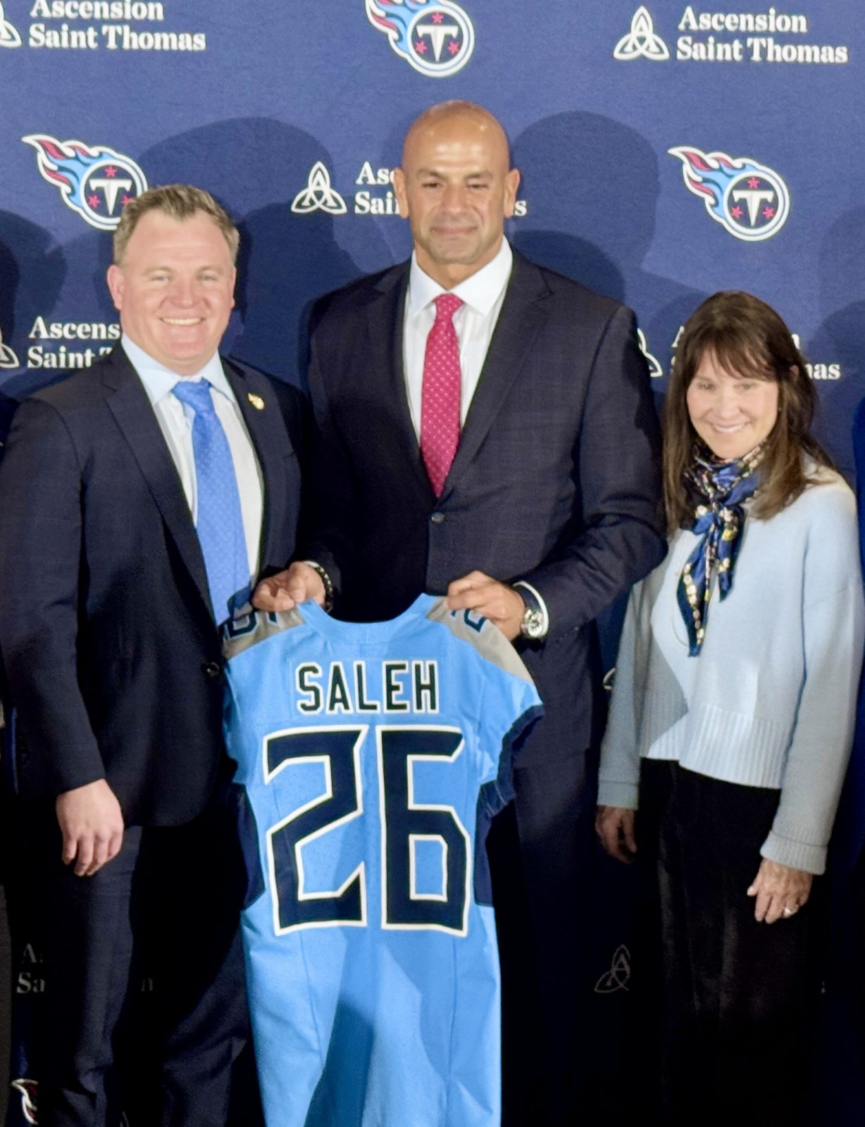 Mike Borgonzi, Robert Saleh and Amy Adams Strunk