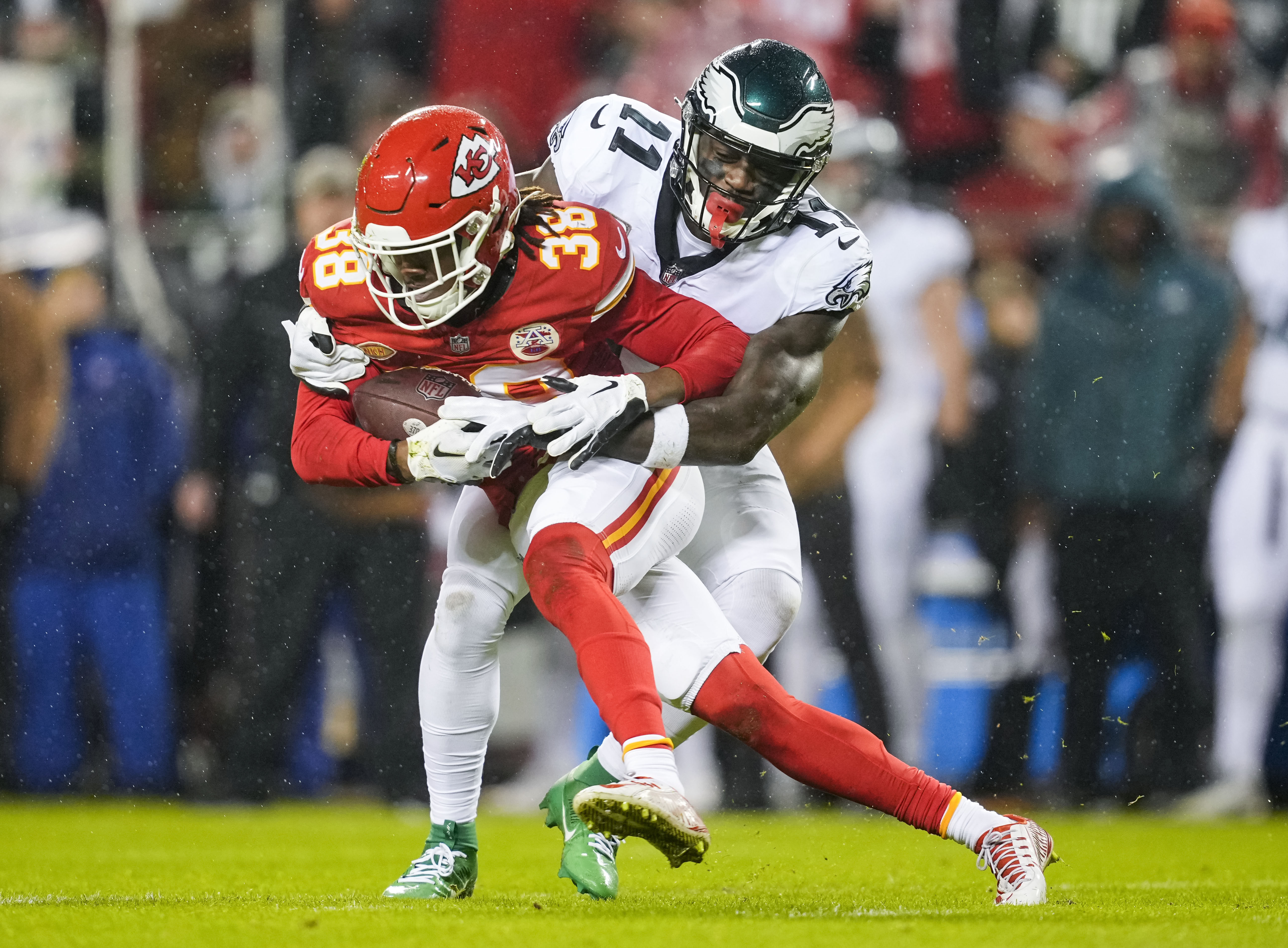 Nov 20, 2023; Kansas City, Missouri, USA; Kansas City Chiefs cornerback L'Jarius Sneed (38) is tackled after intercepting a pass intended for Philadelphia Eagles wide receiver A.J. Brown (11) during the first half at GEHA Field at Arrowhead Stadium. Mandatory Credit: Jay Biggerstaff-USA TODAY Sports