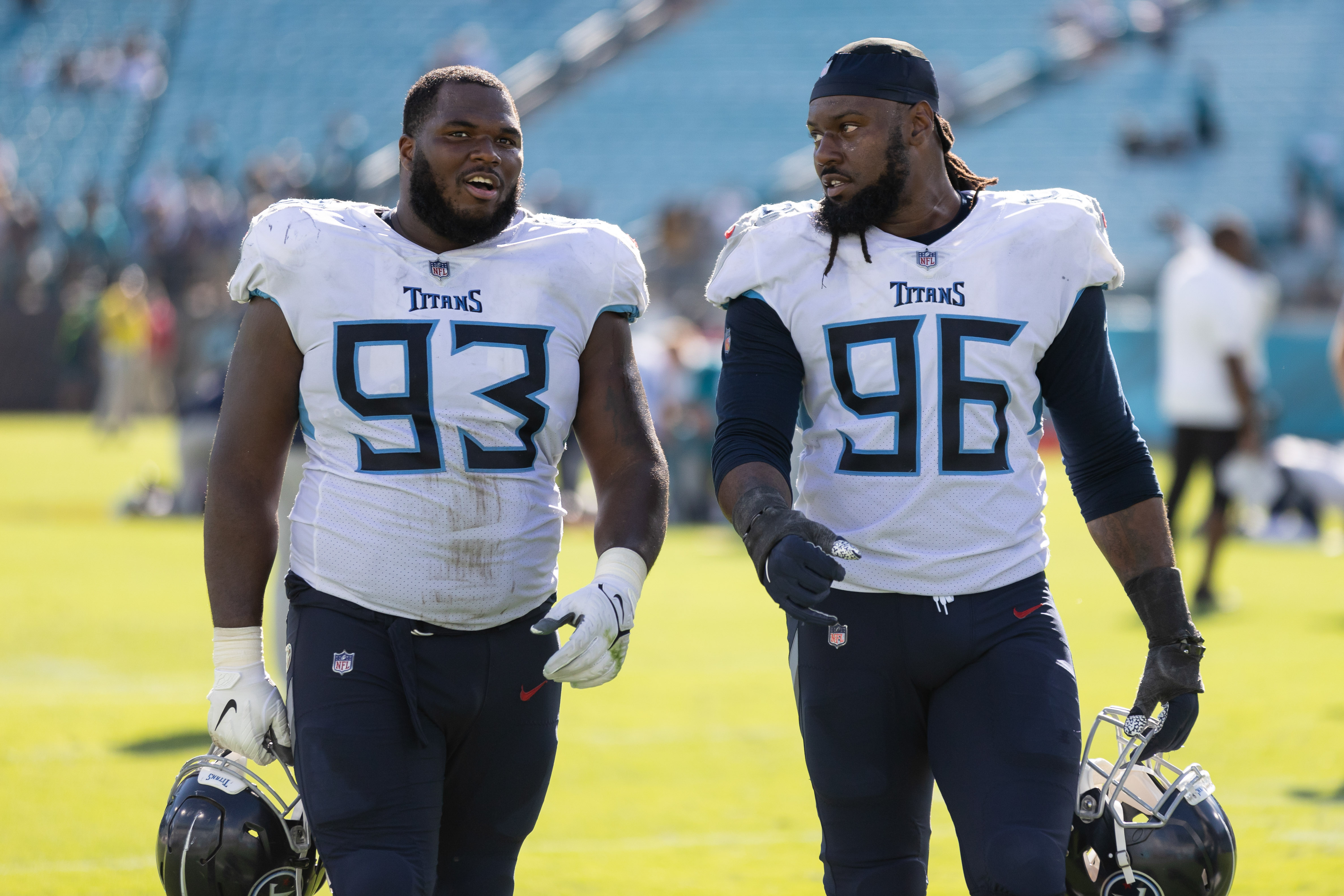 Oct 10, 2021; Jacksonville, Florida, USA; Tennessee Titans defensive tackle Teair Tart (93) and Tennessee Titans defensive end Denico Autry (96) walk off the field after the game against the Jacksonville Jaguars at TIAA Bank Field. Mandatory Credit: Matt Pendleton-USA TODAY Sports