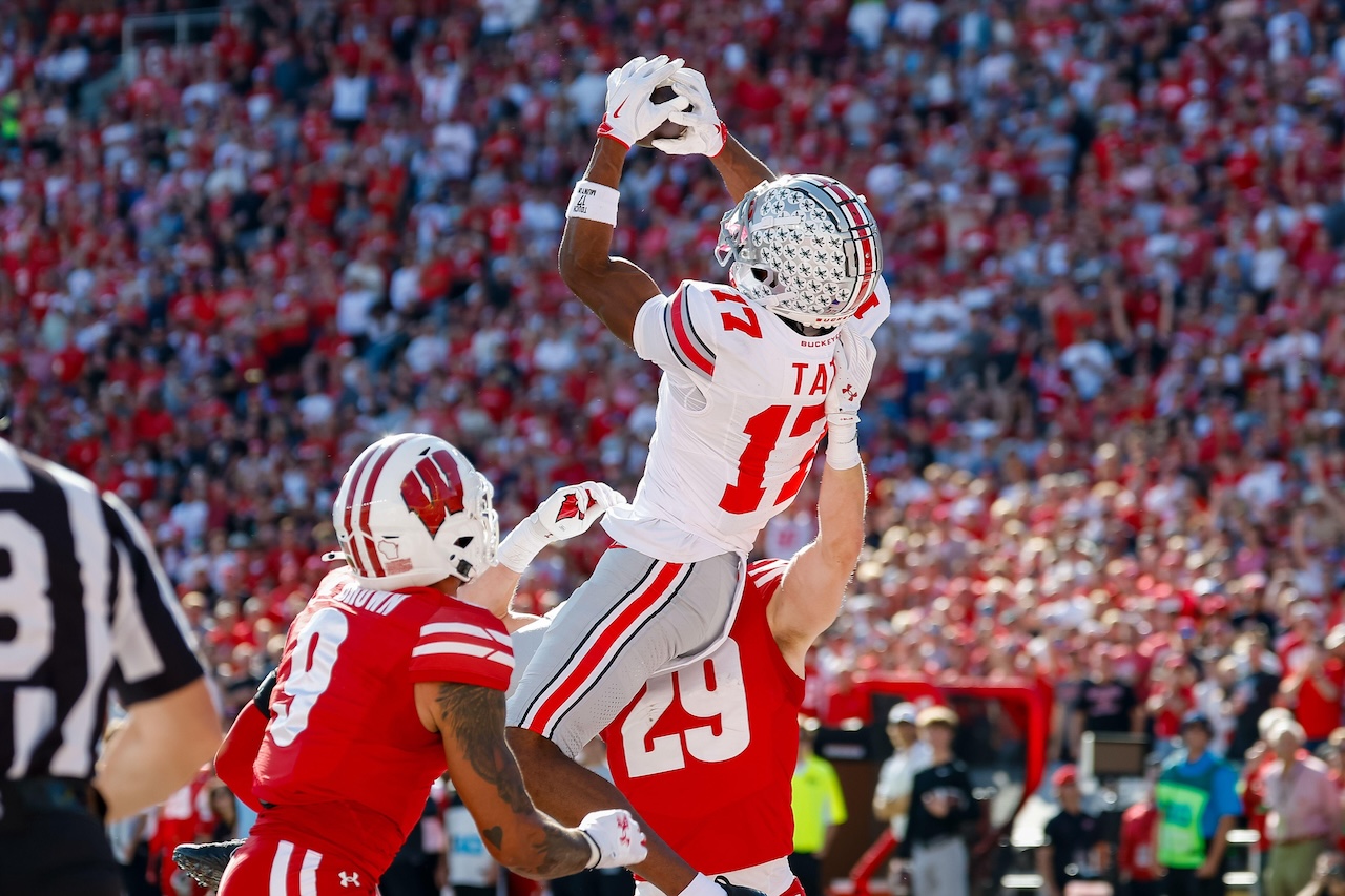 Madison, WI, USA. 18th Oct, 2025. Ohio State Buckeyes wide receiver Carnell Tate (17) catches a 10 yard touchdown pass during the NCAA Football game between the Ohio State Buckeyes and the Wisconsin Badgers at Camp Randall Stadium in Madison, WI. Darren Lee/CSM/Alamy Live News