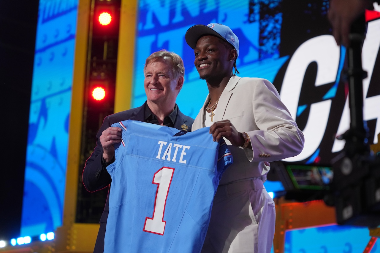 Ohio State wide receiver Carnell Tate poses with NFL Commissioner Roger Goodell after being chosen by the Tennessee Titans with the fourth overall pick during the first round of the NFL football draft, Thursday, April 23, 2026, in Pittsburgh. (AP Photo/Gene J. Puskar)