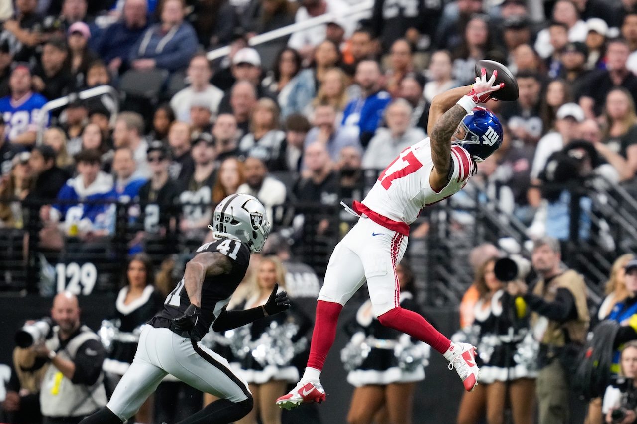 New York Giants wide receiver Wan'Dale Robinson (17) makes a catch against Las Vegas Raiders cornerback Greedy Vance (41) during the first half of an NFL football game Sunday, Dec. 28, 2025, in Las Vegas. (AP Photo/John Locher)