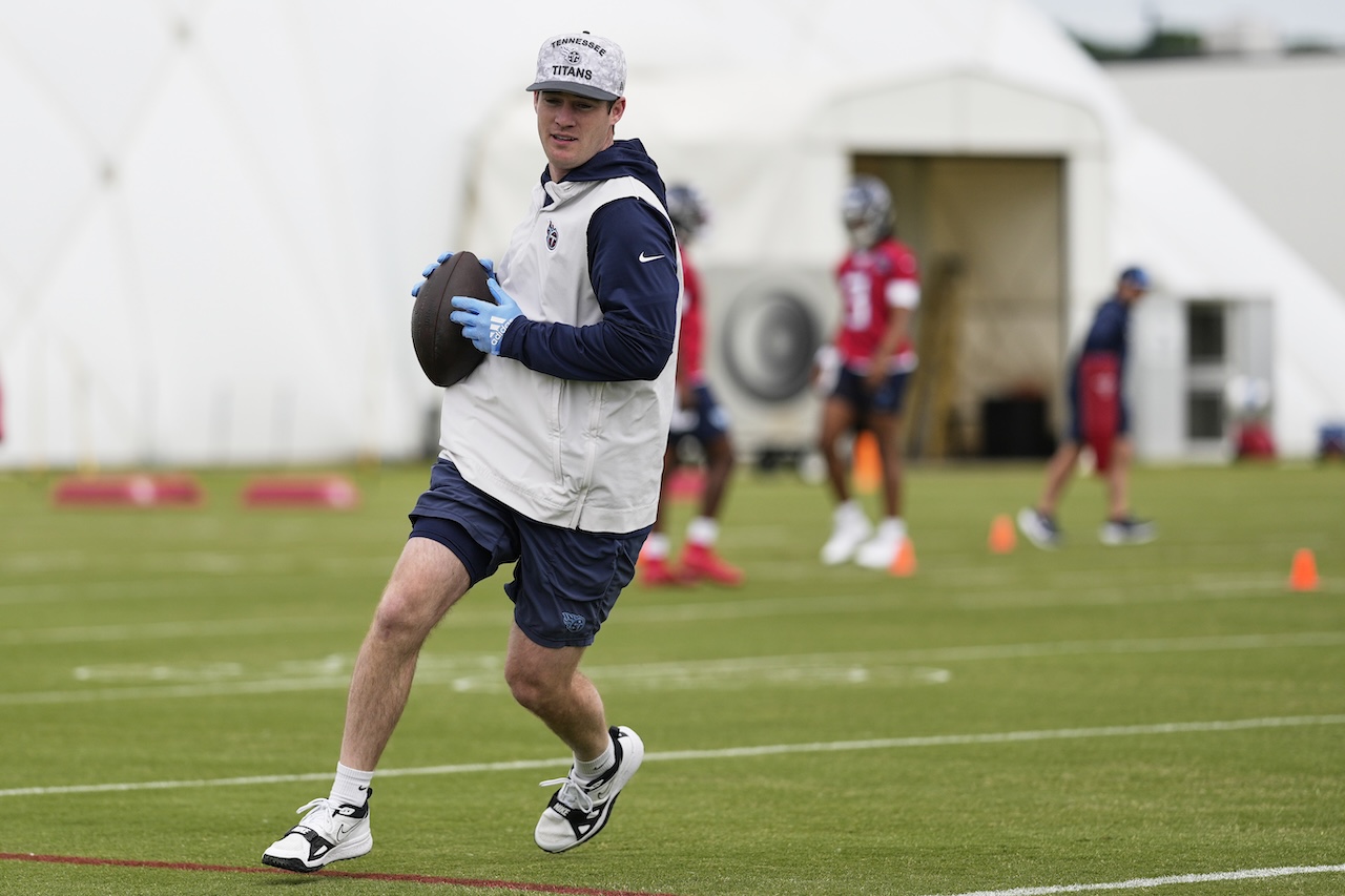Tennessee Titans football operations chief of staff Bryce Wasserman runs across the field with the ball during the NFL football team's rookie minicamp Saturday, May 10, 2025, in Nashville, Tenn. (AP Photo/George Walker IV)