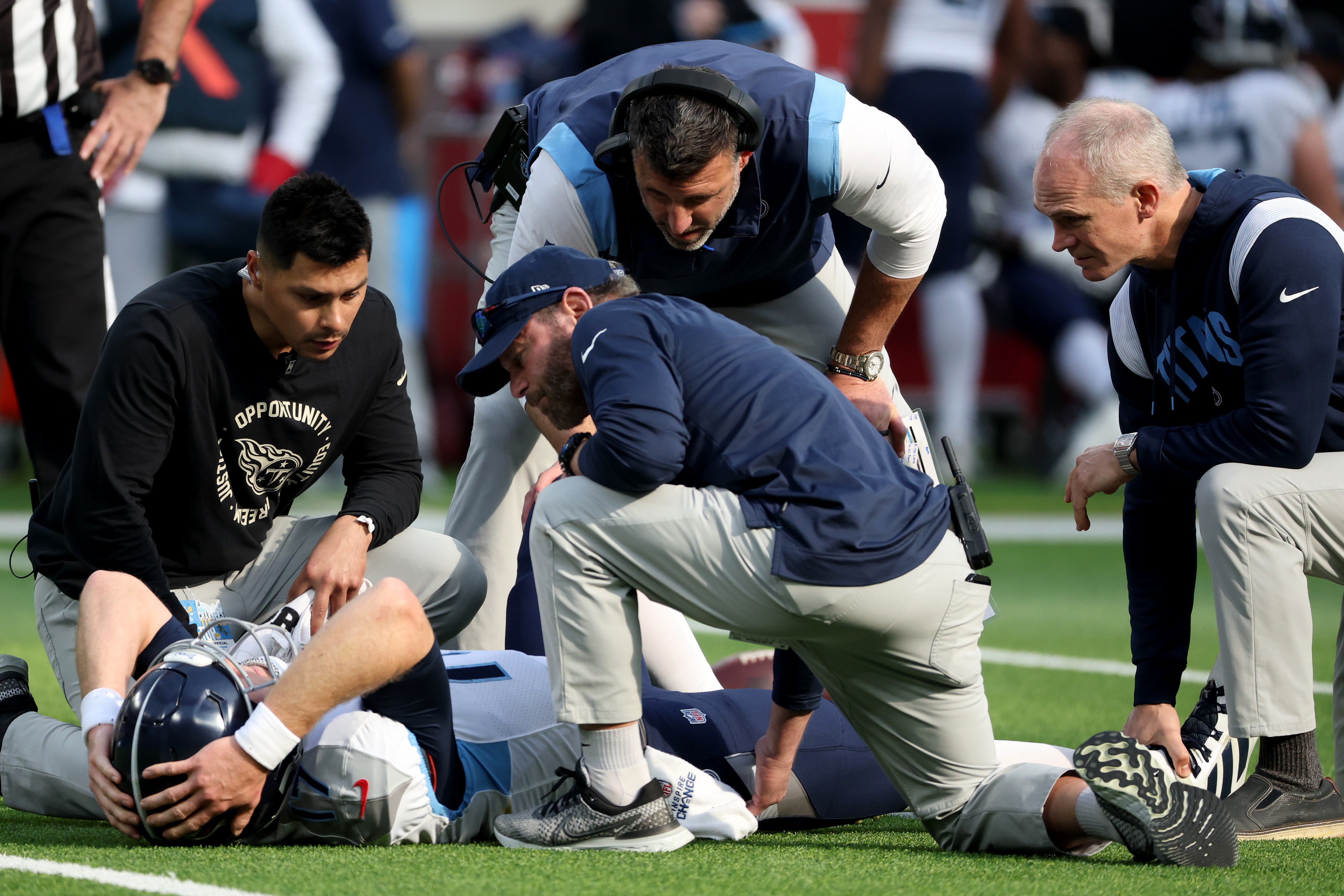 Dec 18, 2022; Inglewood, California, USA; Tennessee Titans quarterback Ryan Tannehill (17) is tended to by medical staff during the first quarter of the game against the Los Angeles Chargers at SoFi Stadium. Mandatory Credit: Kiyoshi Mio-USA TODAY Sports