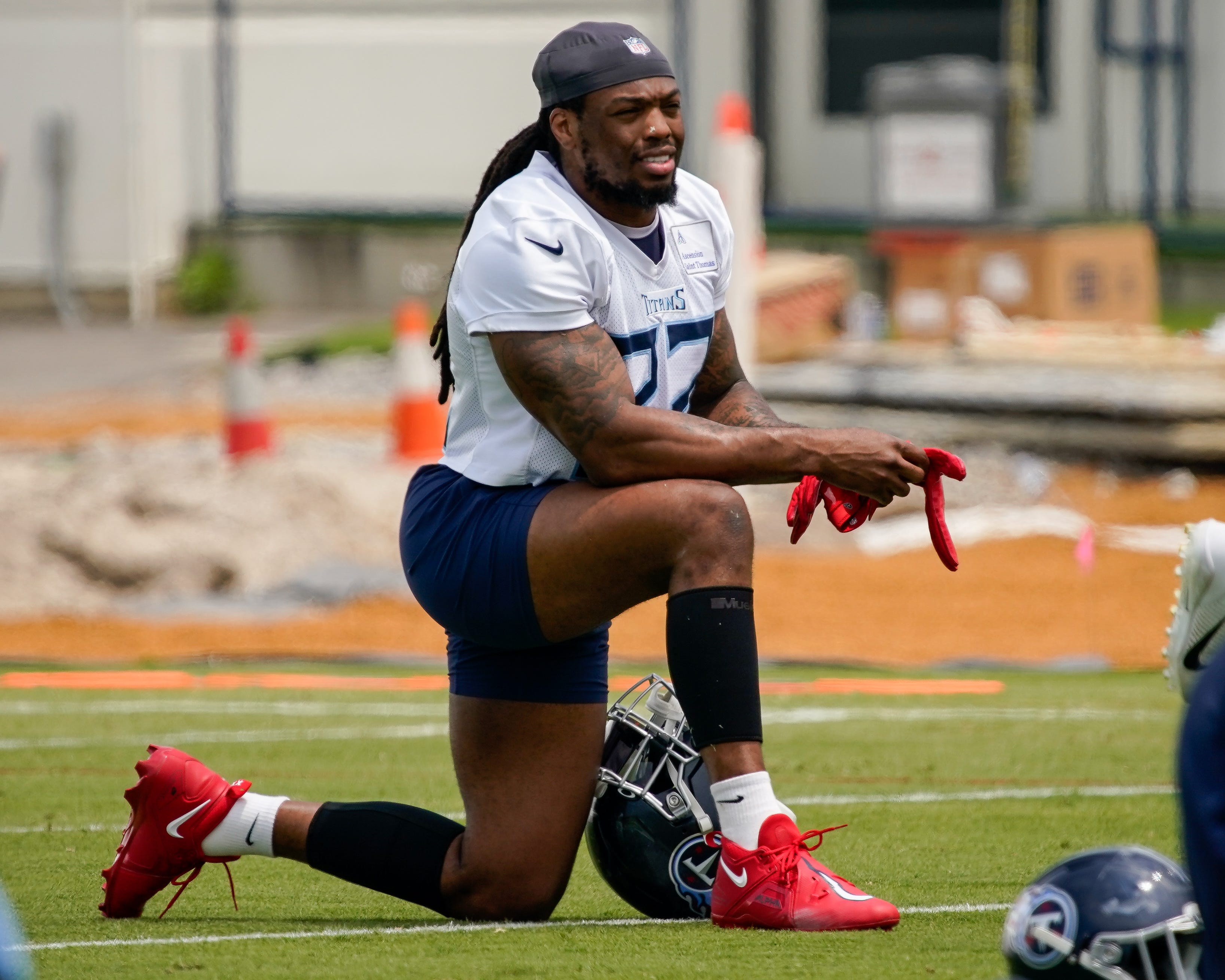 Tennessee Titans running back Derrick Henry (22) stretches during an OTA practice at Ascension Saint Thomas Sports Park in Nashville, Tenn., Tuesday, May 23, 2023.