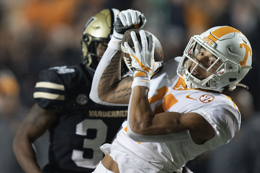 Nov 26, 2022; Nashville, Tennessee, USA; Tennessee Volunteers wide receiver Jalin Hyatt (11) pulls in a first down catch against Vanderbilt Commodores defensive back Ja'Dais Richard (34) during the first quarter at FirstBank Stadium. Mandatory Credit: George Walker IV - USA TODAY Sports