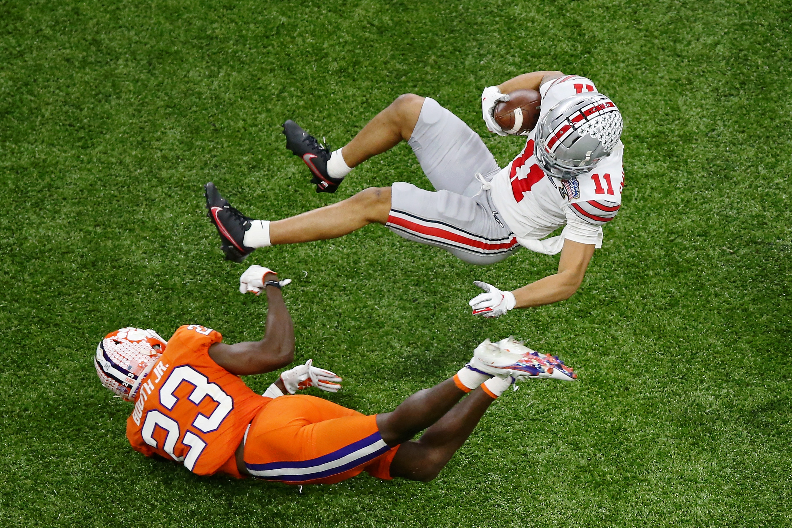 Jan 1, 2021; New Orleans, LA, USA; Clemson Tigers cornerback Andrew Booth Jr. (23) upends Ohio State Buckeyes wide receiver Jaxon Smith-Njigba (11) during the third quarter at Mercedes-Benz Superdome.