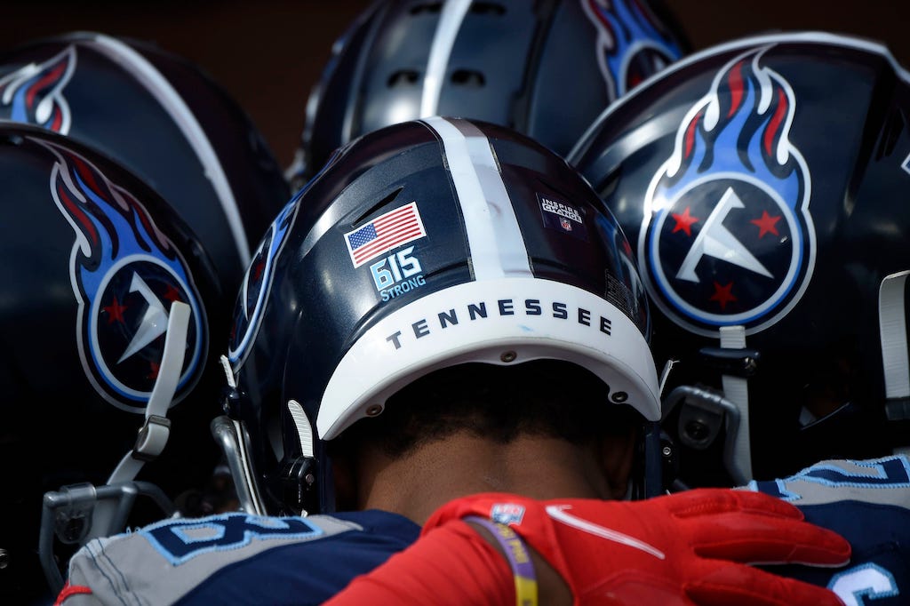 Titans players wear a \"615 Strong\" logo on their helmets as they face the Baltimore Ravens on January 10, 2021. The logo refers to Nashville's efforts to recover after the Christmas morning bombing. Titans Ravens 021